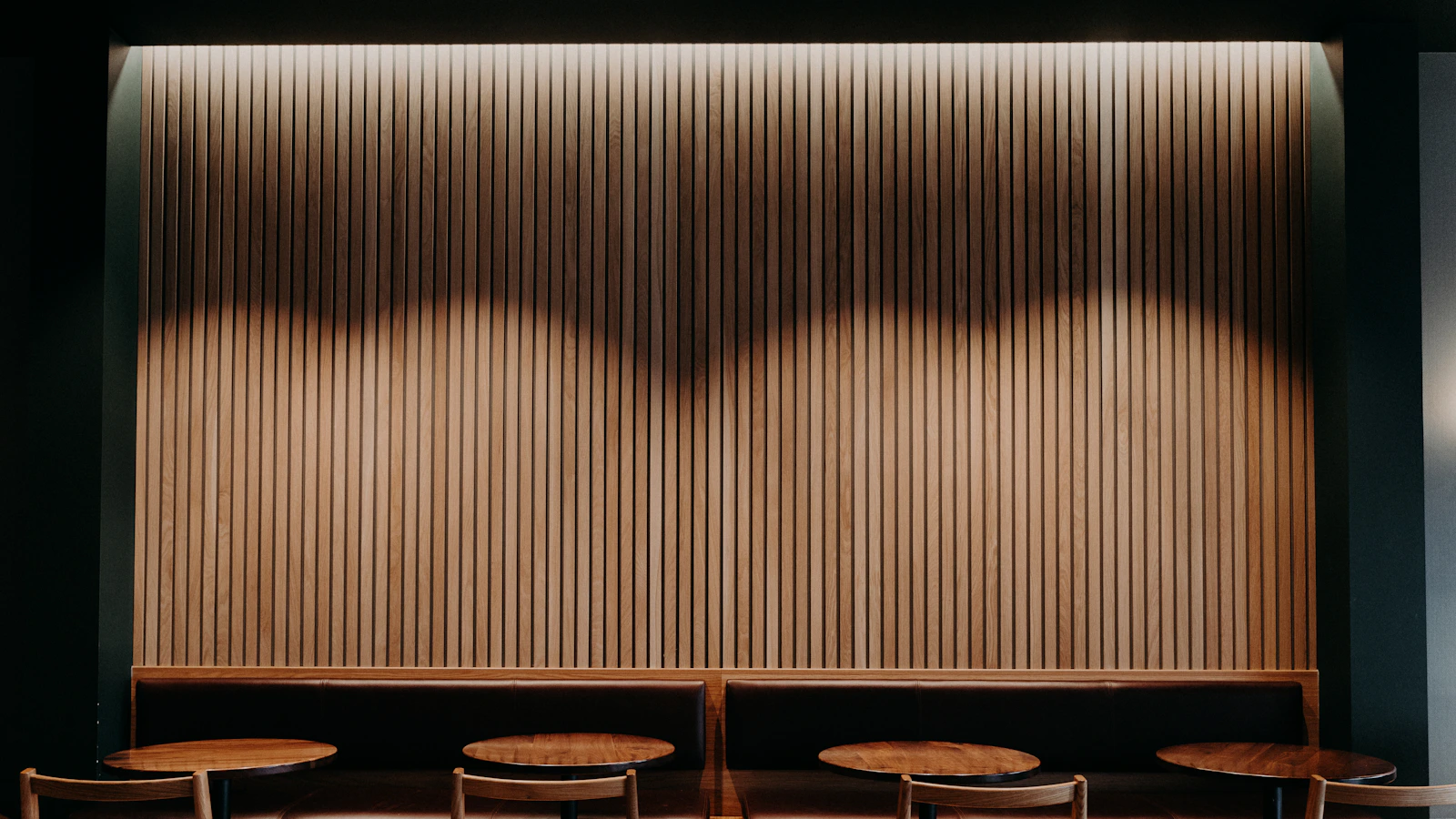 Cafe interior showing wooden chairs in a hospitality seating environment