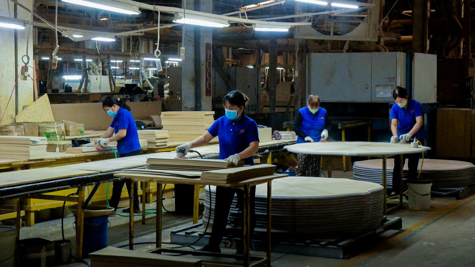 Furniture production work in a factory illustrating batch-based manufacturing