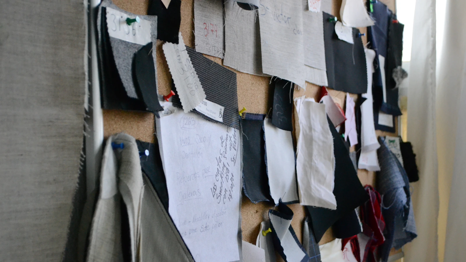 Textile and material samples prepared for furniture specification review