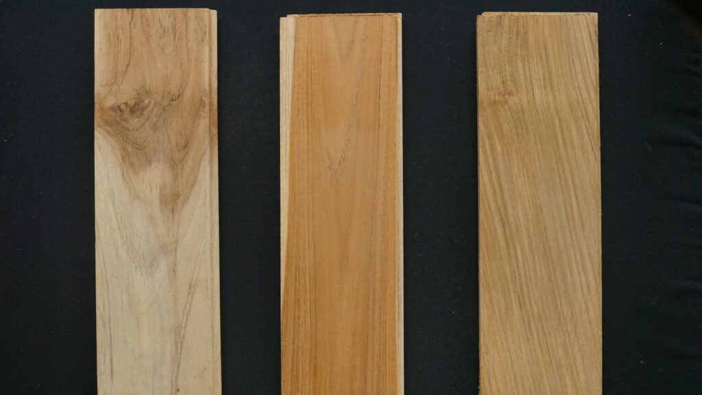 Natural hardwood boards showing contrasting grain patterns for wood species comparison