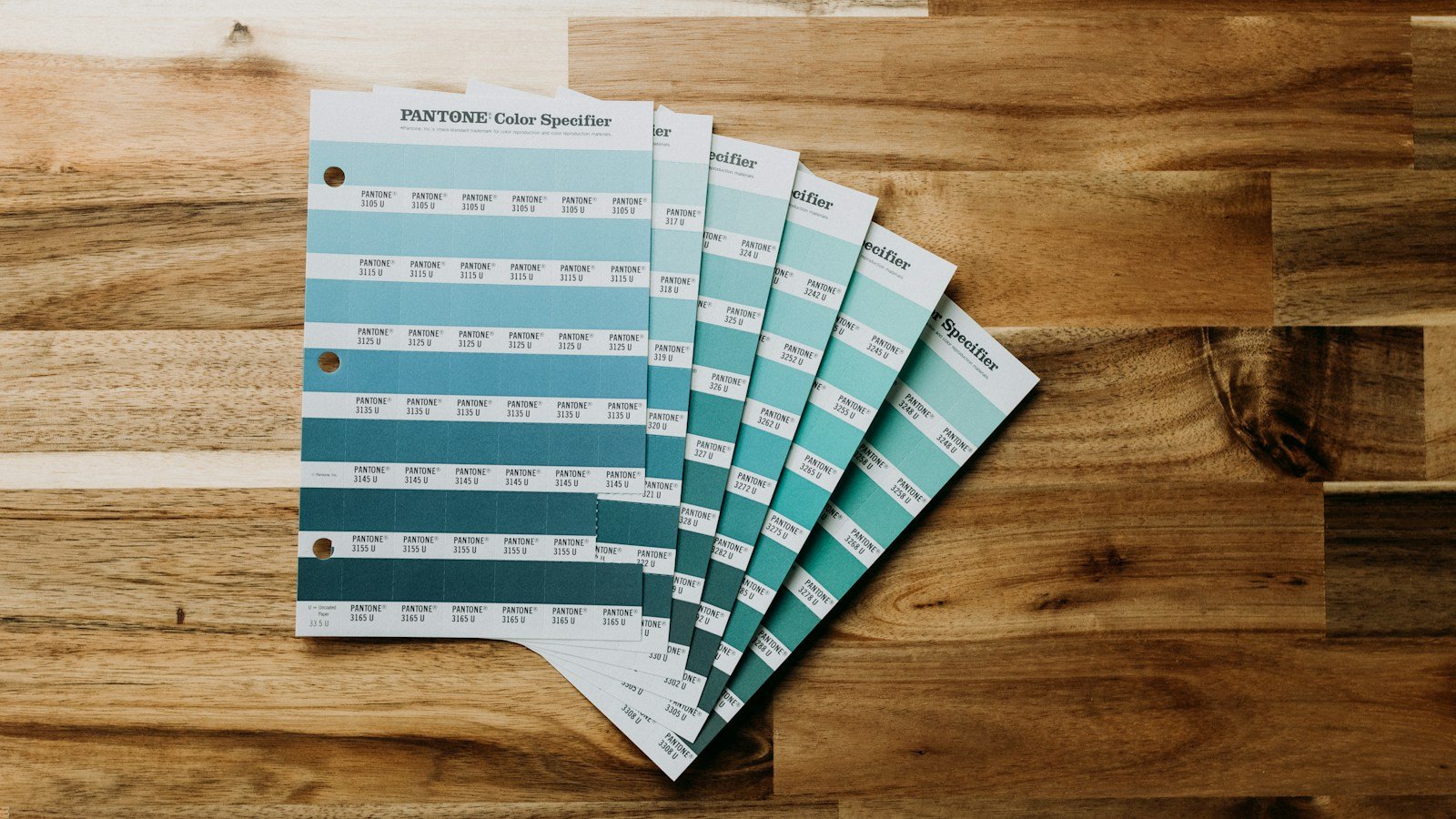 Wood surface with color samples used to compare finish directions