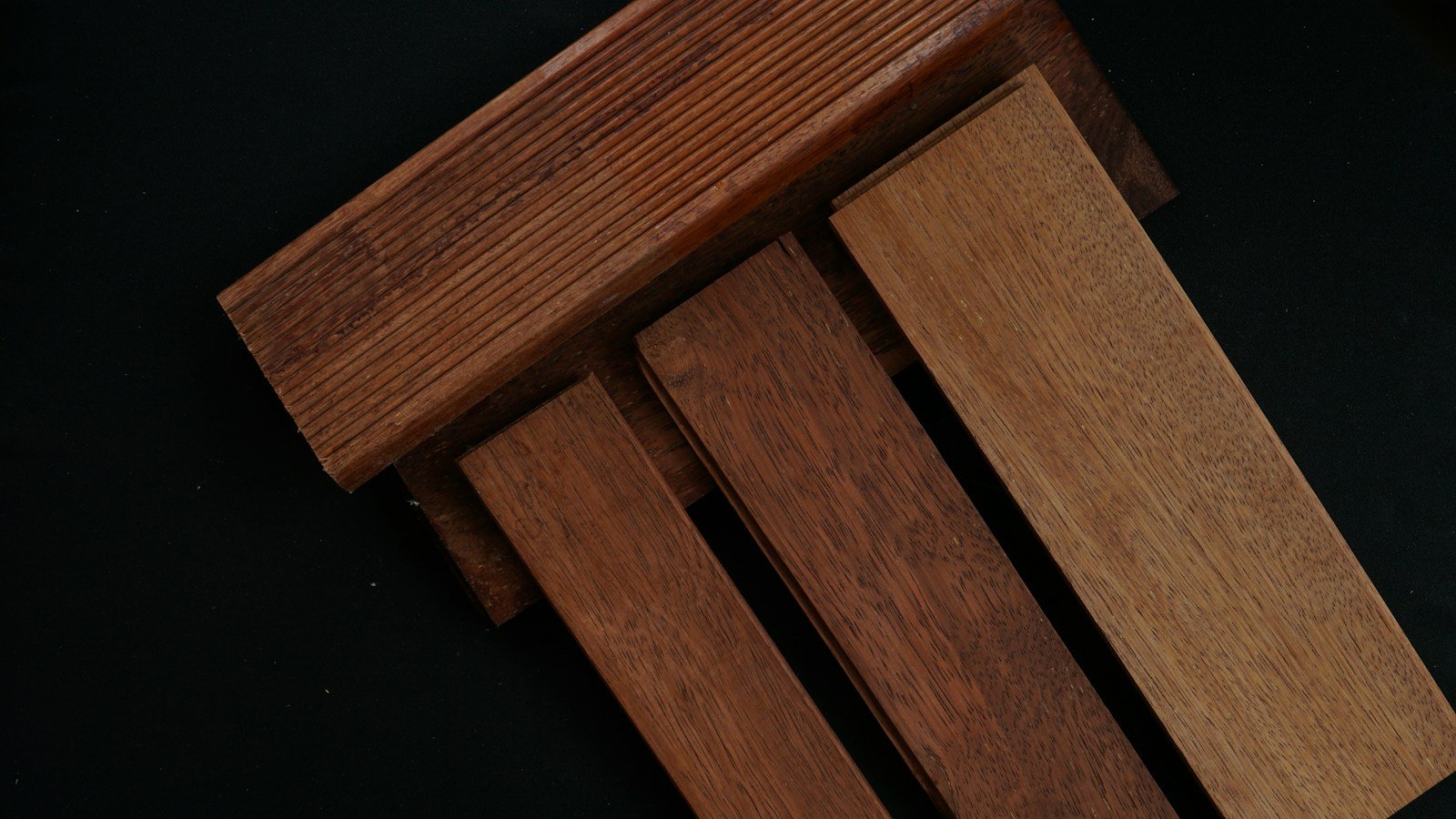Wood boards showing variation in tone and grain across finished surfaces